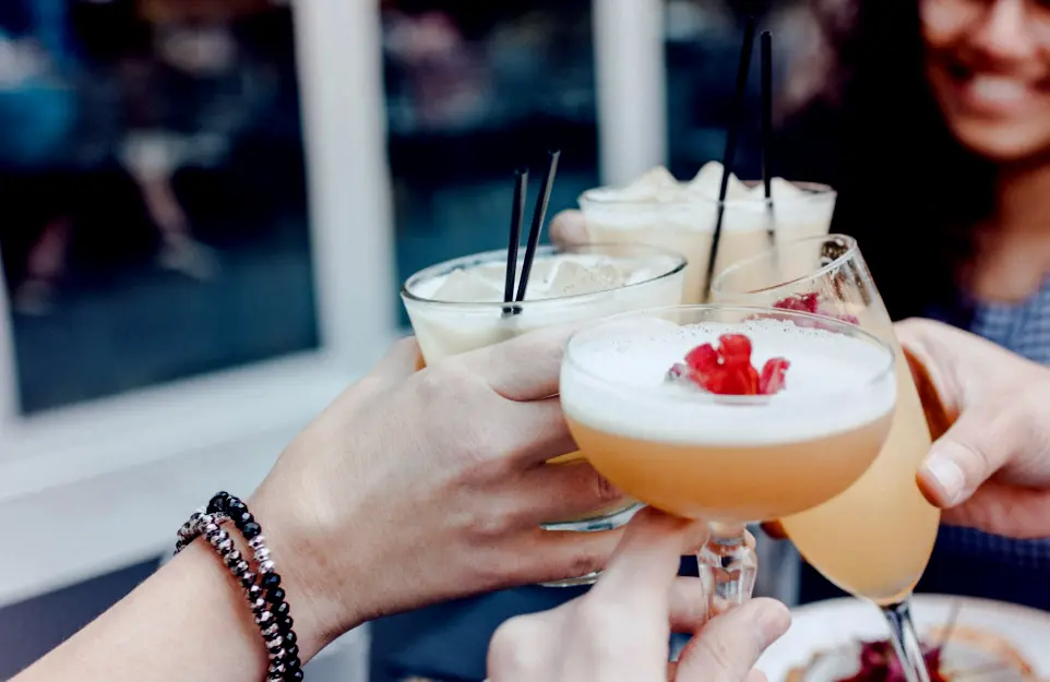 A toast with cocktails.