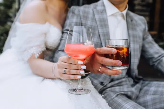 Bride and groom toasting with signature wedding cocktails
